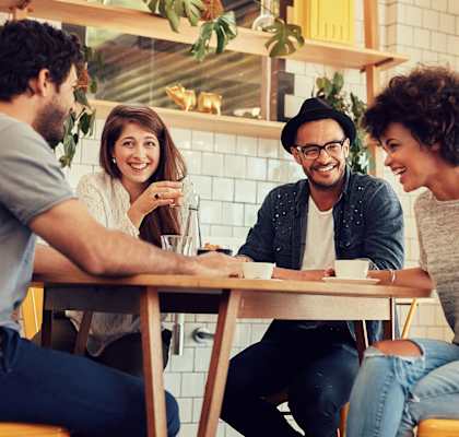a group of people sitting around a table